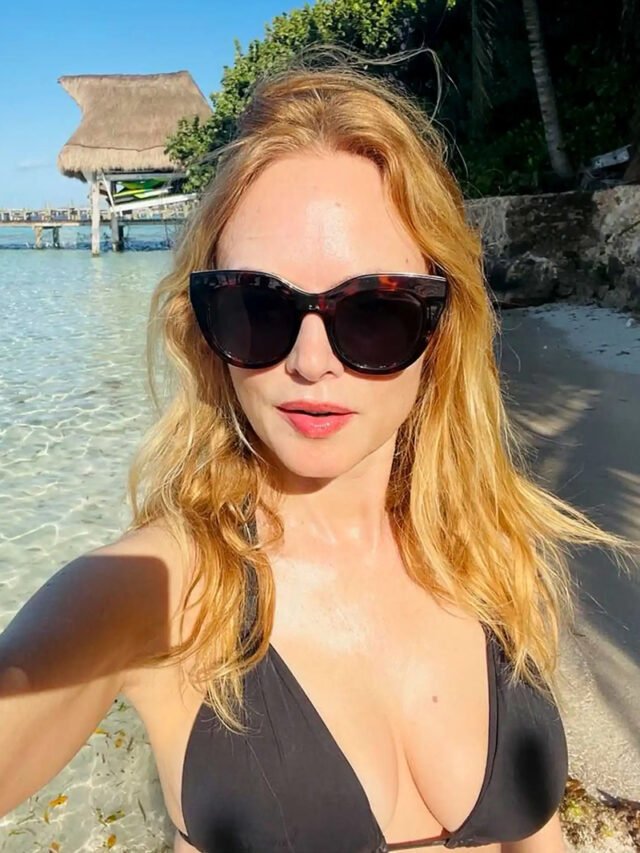 Heather Graham in a black bikini on the Los Angeles beach, Labor Day weekend